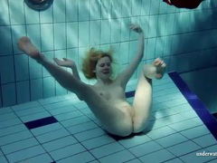 TitsCult presents: Blonde goes for a swim and strips