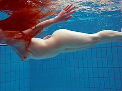 TitsCult presents: Redhead simonna showing her body underwater