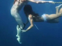 TitsCult presents: Bikini girls swim in the ocean and strip