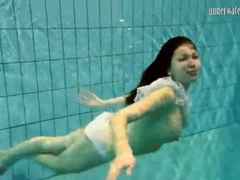 TitsCult presents: Girl in white panties swims in pool
