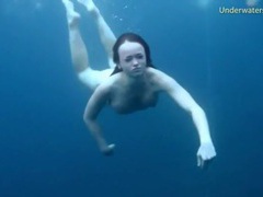 TitsCult presents: Three ladies get naked swimming in the ocean