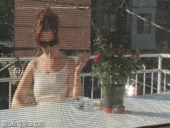 TitsCult presents: Cute chick smokes on the porch as he films it