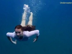TitsCult presents: Chick gets naked swimming in the ocean