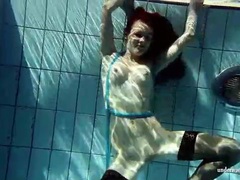TitsCult presents: In black stockings pretty girl goes for a swim
