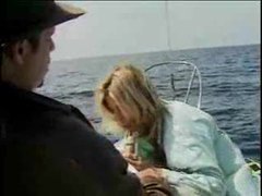 TitsCult presents: Babe on a boat sucking a hot cock