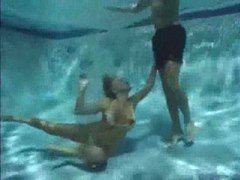 TitsCult presents: She has a threesome underwater