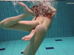 TitsCult presents: Underwater with a busty naked babe as she swims