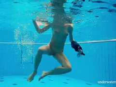 TitsCult presents: Teen strips off her dress as she goes for a swim
