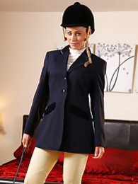 TitsCult presents: Clare R seductifvely removes her riding gear leaving on only opaque hold ups and sheer underwear