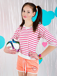 TitsCult presents: Adorable looking brunette model starts to tease us in her nice small clothing before almost taking of her bras