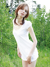TitsCult presents: Timid teen girl comes to the nature and poses her beautiful body in front of the camera.