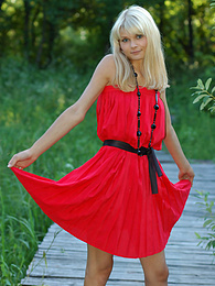 TitsCult presents: Naughty teen appears in her sexy red dress and starts removing it passionately and moving slowly.